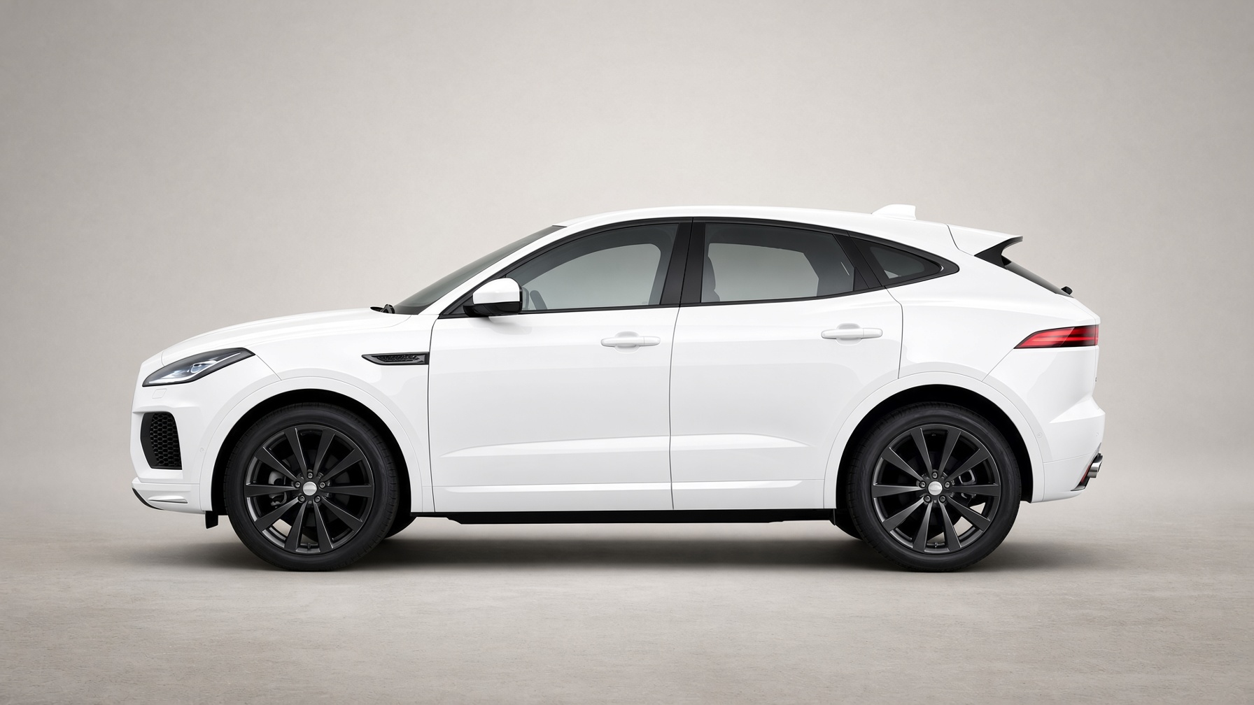 Side profile of a Fuji white Jaguar E-PACE R-Dynamic